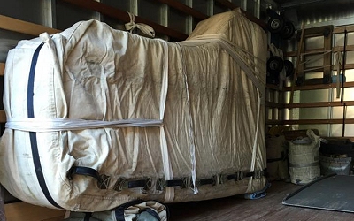 Pianos secured inside of shipping truck